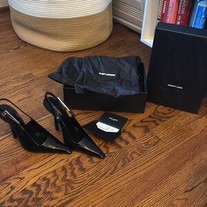 Sling back pumps with square pointed toe,square cut vamp and stiletto heel. YSL